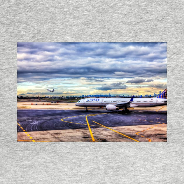 United Airlines And Manhattan Skyline At JFK Airport, New York by tommysphotos